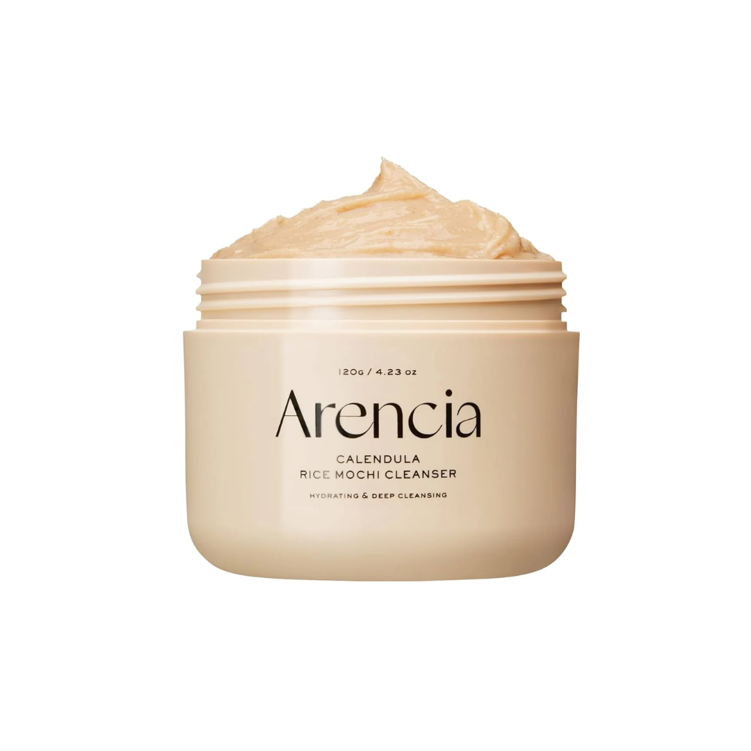 ARENCIA Calendula Rice Mochi Cleanser is a gentle exfoliating cleanser that combines Rice Powder and Sweet Almond Seed Meal to softly polish away dead skin cells. Infused with Calendula, Witch Hazel, and Houttuynia Cordata Extract, it soothes and refreshes the skin while maintaining moisture. Ideal for daily use to reveal a smoother, brighter complexion.