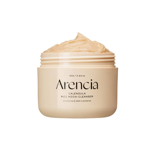 ARENCIA Calendula Rice Mochi Cleanser is a gentle exfoliating cleanser that combines Rice Powder and Sweet Almond Seed Meal to softly polish away dead skin cells. Infused with Calendula, Witch Hazel, and Houttuynia Cordata Extract, it soothes and refreshes the skin while maintaining moisture. Ideal for daily use to reveal a smoother, brighter complexion.