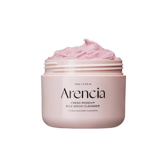 ARENCIA Fresh Rosehip Rice Mochi Cleanser is a soft, exfoliating cleanser made with Rice Powder and Sweet Almond Seed Meal to gently remove dead skin and impurities. Enriched with Rosehip Extract, Chamomile, and Aloe Vera, it helps soothe and brighten the skin while maintaining moisture. Perfect for a fresh, radiant glow.