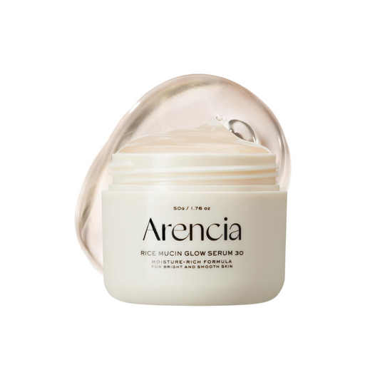 ARENCIA Rice Mucin Glow Serum 30 is a brightening and firming serum infused with over 48% rice ferment filtrate to deeply hydrate and revitalize the skin. With Niacinamide, Retinal, and Hyaluronic Acid, it helps improve skin tone, reduce dullness, and smooth fine lines for a radiant, healthy-looking glow. Perfect for those seeking moisture and a luminous finish.