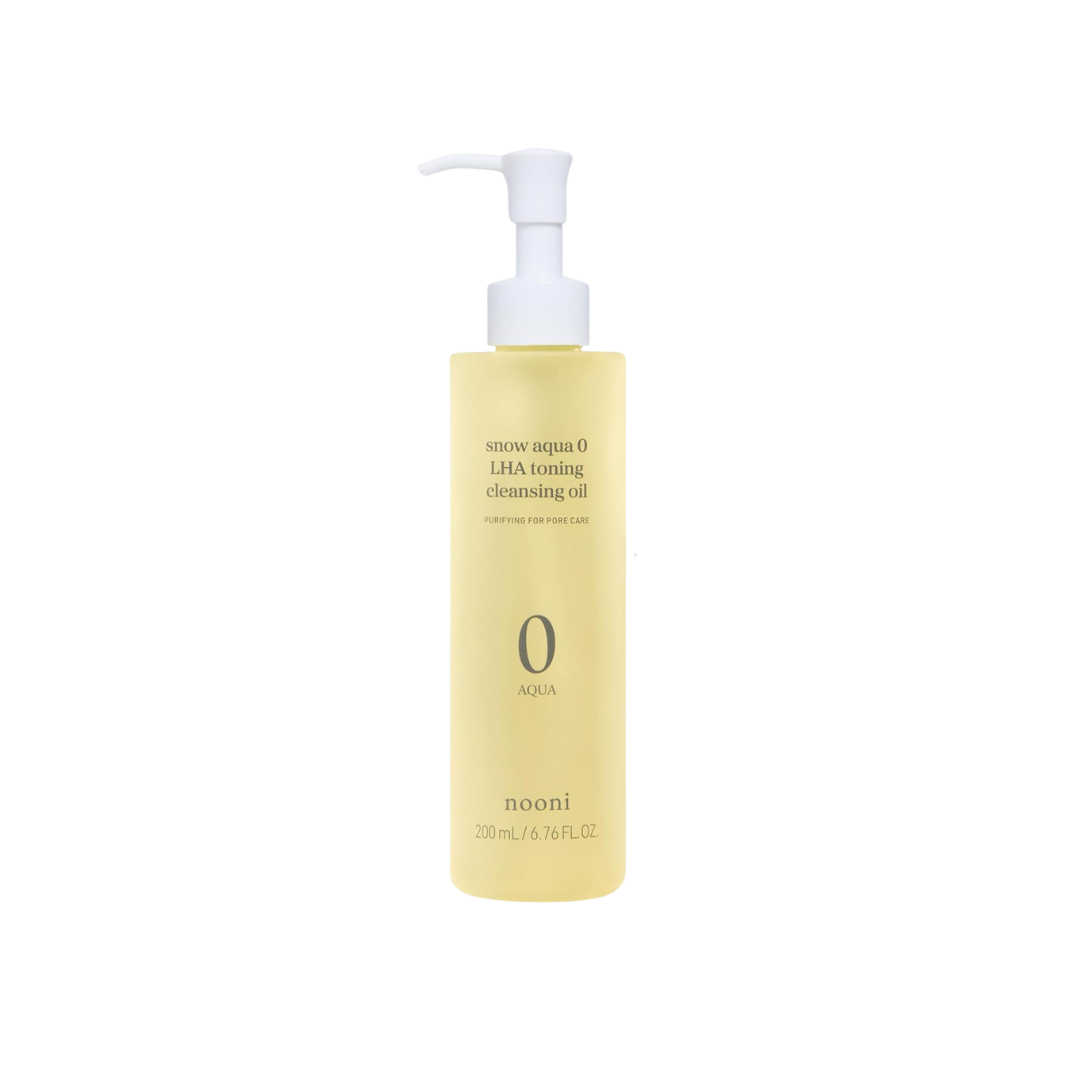 NOONI Snow Aqua 0 LHA Toning Cleansing Oil is a refreshing, oil-based cleanser designed to remove makeup, impurities, and excess oil while gently exfoliating the skin. Formulated with Capryloyl Salicylic Acid (LHA), it helps to clear clogged pores and smooth the skin’s texture. Infused with nourishing oils such as Grape Seed, Olive, and Macadamia Seed Oil, it hydrates and balances the skin without leaving a greasy residue. The addition of Orange and Lime Peel Oils provides a fresh, citrus scent while offeri
