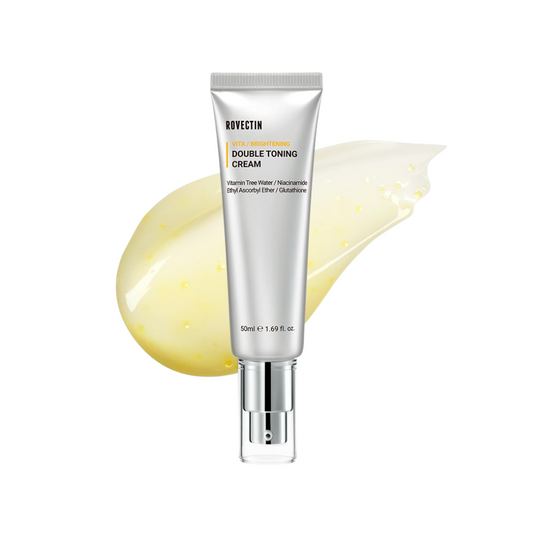 ROVECTIN Vita Double Toning Cream is a brightening and nourishing moisturizer that improves skin tone and radiance. Formulated with Niacinamide, Vitamin C Derivatives, and Arbutin, it helps fade dark spots, even out discoloration, and boost luminosity. Enriched with Sea Buckthorn Water, Glutathione, and Ferulic Acid, it delivers antioxidant protection while supporting a healthy, youthful glow. With added Hyaluronic Acid, Centella Asiatica, and Jojoba Esters, this cream hydrates and soothes, leaving skin smo