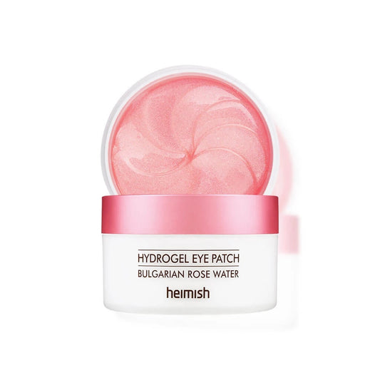 HEIMISH Bulgarian Rose Water Hydrogel Eye Patch is a soothing and hydrating treatment for the delicate under-eye area. Infused with Rosa Damascena Flower Water and Niacinamide, it brightens and revitalizes tired eyes while reducing the appearance of dark circles. Enriched with Centella Asiatica Extract and Sodium Hyaluronate, these hydrogel patches deliver deep hydration and a calming effect. Perfect for daily use or a quick skin refresh, they leave your under-eye area feeling smooth, nourished, and visibly