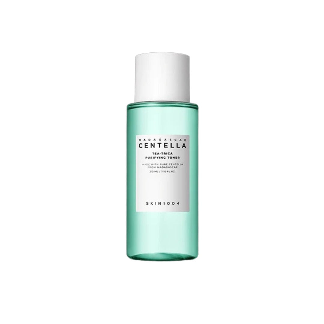 SKIN1004 Madagascar Centella Tea-Trica Purifying Toner is a refreshing and clarifying toner designed to soothe and balance the skin. It features 12% Tea Tree Leaf Water and 9.8% Centella Asiatica Extract to calm irritation and reduce redness while promoting a healthy skin barrier. Infused with Salicylic Acid, it gently exfoliates and helps unclog pores, making it ideal for acne-prone and sensitive skin. With added Lavender Extract and Castanea Crenata Shell Extract, it nourishes and refreshes, leaving your