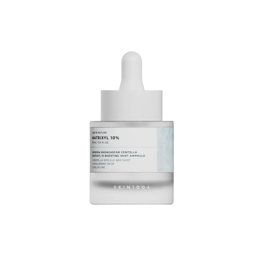 SKIN1004 Madagascar Centella Matrixyl 10 Boosting Shot Ampoule is a firming and hydrating treatment designed to improve skin elasticity and smooth fine lines. Powered by Matrixyl peptides (Palmitoyl Tripeptide-1 and Palmitoyl Tetrapeptide-7) and 5% Volufiline (Anemarrhena Asphodeloides Root Extract), it helps plump and revitalize aging skin. Centella Asiatica, Madecassoside, and Panthenol soothe and support the skin barrier, while Hydrolyzed Hyaluronic Acid provides deep hydration. Ideal for dull, tired, or