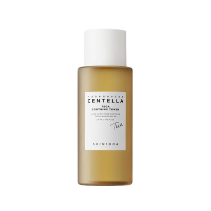 SKIN1004 Madagascar Centella Teca Soothing Toner is a lightweight hydrating toner designed to calm the skin and support a healthy moisture barrier. Enriched with Centella Asiatica and Teca, it helps reduce redness while maintaining oil-moisture balance. With Sodium Hyaluronate and Glyceryl Glucoside, it delivers long-lasting hydration, while gentle exfoliating ingredients help refine skin texture. The soothing formula leaves skin smooth, balanced, and refreshed. Suitable for all skin types, especially sensi